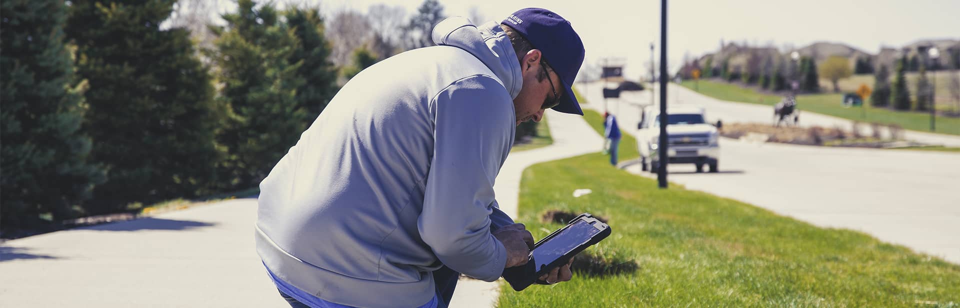 Working on a suburban road, planning irrigation